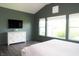 Comfortable bedroom with a vaulted ceiling, large windows, and stylish furniture for a peaceful retreat at 13820 Woodside Hollow Dr, Carmel, IN 46032