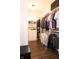 Spacious walk-in closet with custom shelving and rods for ample storage and organization at 13820 Woodside Hollow Dr, Carmel, IN 46032