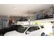 Spacious garage with ample overhead storage, two cars parked inside at 13820 Woodside Hollow Dr, Carmel, IN 46032