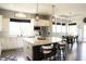 Bright, open kitchen boasts a large center island with seating and stainless steel appliances at 13820 Woodside Hollow Dr, Carmel, IN 46032