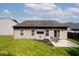 A spacious backyard featuring a patio with outdoor seating, perfect for relaxing and entertaining at 15308 Wolf Run Ct, Noblesville, IN 46060