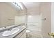 This bathroom features a single sink vanity and shower-tub combination at 15308 Wolf Run Ct, Noblesville, IN 46060