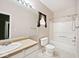 Bathroom with vanity, toilet, and shower-tub combination at 15308 Wolf Run Ct, Noblesville, IN 46060