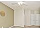 Bedroom showcasing a neutral color scheme, closet, and multiple doors at 15308 Wolf Run Ct, Noblesville, IN 46060