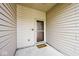 Cozy covered front porch with neutral siding and a welcoming doormat at 15308 Wolf Run Ct, Noblesville, IN 46060