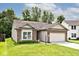 Attractive home with brick and vinyl siding, a manicured lawn, and an attached two-car garage at 15308 Wolf Run Ct, Noblesville, IN 46060