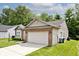 Pleasant suburban home with well-maintained landscaping and a two-car garage, nestled in a quiet neighborhood at 15308 Wolf Run Ct, Noblesville, IN 46060