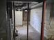 Utility basement with pipes and concrete block walls at 1601 S Biltmore Ave, Muncie, IN 47302