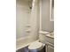 Cozy bathroom with a shower-tub combo and white fixtures at 1601 S Biltmore Ave, Muncie, IN 47302
