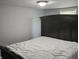 Bedroom features a large dark wood headboard and white bedding at 1601 S Biltmore Ave, Muncie, IN 47302