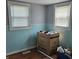 Bright room with two windows and teal wainscoting at 1601 S Biltmore Ave, Muncie, IN 47302