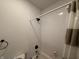 Clean bathroom with white subway tile and dark fixtures at 1720 Rembrandt St, Indianapolis, IN 46202
