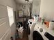 Functional laundry room with modern washer and dryer, and a water heater for added convenience at 1720 Rembrandt St, Indianapolis, IN 46202
