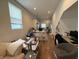 Open-concept living room showcasing natural light and hardwood floors, offering flexible design possibilities at 1720 Rembrandt St, Indianapolis, IN 46202