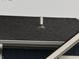 Close-up of the roof featuring black shingles and white gutters, showcasing the quality of the roofing materials at 1720 Rembrandt St, Indianapolis, IN 46202