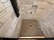 New tile shower with overhead nozzle and inset shelving at 1720 Rembrandt St, Indianapolis, IN 46202