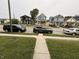 Street view with well-maintained sidewalks, parked cars, and various houses, offering a glimpse of the neighborhood at 1720 Rembrandt St, Indianapolis, IN 46202