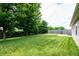 Expansive lawn complemented by lush greenery and privacy fences, creating a serene outdoor retreat at 1792 Persimmon Grove Dr, Indianapolis, IN 46234