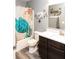Bathroom with a tub and a vanity with a white countertop and dark cabinets at 1792 Persimmon Grove Dr, Indianapolis, IN 46234