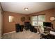 Comfortable room featuring a large window, dark desk, neutral walls, and plush carpet for a cozy atmosphere at 1792 Persimmon Grove Dr, Indianapolis, IN 46234