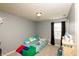 bedroom with brightly colored decorations, gray walls, and plushy sea creature dolls at 1792 Persimmon Grove Dr, Indianapolis, IN 46234