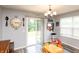 A bright dining area with gray walls and sliding door to the backyard at 1792 Persimmon Grove Dr, Indianapolis, IN 46234