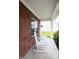 Relaxing front porch featuring classic white rocking chairs at 1792 Persimmon Grove Dr, Indianapolis, IN 46234