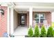 Inviting front porch with rocking chairs and a charming entrance at 1792 Persimmon Grove Dr, Indianapolis, IN 46234