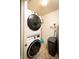 Efficient laundry room showcasing stacked washer and dryer, offering convenience and space-saving design at 1792 Persimmon Grove Dr, Indianapolis, IN 46234