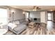 Comfortable living room with modern decor, wood-style flooring, and ample seating at 1792 Persimmon Grove Dr, Indianapolis, IN 46234