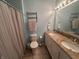 Cozy bathroom with double sinks, a shower/tub combo, and nice tile floors at 19409 Mimosa Ct, Noblesville, IN 46060