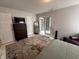 Comfortable bedroom with doors to another room and carpet over concrete floors at 19409 Mimosa Ct, Noblesville, IN 46060