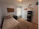 Comfortable bedroom with a twin bed, carpet floors, and a large window at 19409 Mimosa Ct, Noblesville, IN 46060