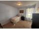 Cozy bedroom with a twin bed, carpet floors, and lots of natural light from the window at 19409 Mimosa Ct, Noblesville, IN 46060