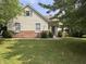 Charming two-story home featuring a well-maintained lawn and brick accents near the foundation at 19409 Mimosa Ct, Noblesville, IN 46060