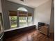 Bright kitchen nook with large windows, built-in storage, and stylish decor, perfect for casual dining at 19409 Mimosa Ct, Noblesville, IN 46060