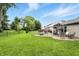Lush backyard with a well-manicured lawn, patio, gazebo, fire pit, and plenty of space for outdoor activities at 19433 Tradewinds Dr, Noblesville, IN 46062