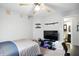 The bedroom features a ceiling fan, TV and gaming setup, and door to the bathroom at 19433 Tradewinds Dr, Noblesville, IN 46062