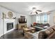 Comfortable living room featuring a cozy fireplace and plush seating at 19433 Tradewinds Dr, Noblesville, IN 46062