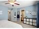 The main bedroom features a ceiling fan, door to the bathroom, and storage cubes at 19433 Tradewinds Dr, Noblesville, IN 46062