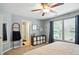 The main bedroom features a ceiling fan, dresser, and door to the bathroom at 19433 Tradewinds Dr, Noblesville, IN 46062