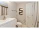 Contemporary bathroom with a sleek white vanity, modern fixtures, and a shower with a stylish curtain at 2105 N Meridian St # 203, Indianapolis, IN 46202