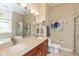Well-lit bathroom with a double sink vanity, large mirror, and a separate glass-enclosed shower at 2105 N Meridian St # 203, Indianapolis, IN 46202