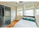 Comfortable bedroom with a double bed, closet and large windows providing natural light at 2105 N Meridian St # 203, Indianapolis, IN 46202