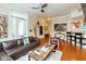 Spacious living room featuring a fireplace, hardwood floors and comfortable seating at 2105 N Meridian St # 203, Indianapolis, IN 46202