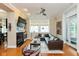 Comfortable living room featuring a fireplace, modern decor and access to a private balcony at 2105 N Meridian St # 203, Indianapolis, IN 46202