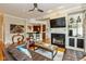 Open concept living space featuring a modern fireplace, built-ins and breakfast bar at 2105 N Meridian St # 203, Indianapolis, IN 46202