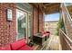 Outdoor patio space featuring a red brick wall, cozy seating, and a stylish fire pit table at 2105 N Meridian St # 203, Indianapolis, IN 46202