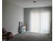 Spacious, empty bedroom featuring a closet with a sliding door and carpeted floors at 219 N 9Th Ave, Beech Grove, IN 46107