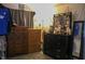 Well-lit bedroom with dressers, decorative mirror, and giraffe plush at 219 N 9Th Ave, Beech Grove, IN 46107
